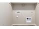 Laundry room with utility hookups and shelving at 21641 N Daniel Dr, Maricopa, AZ 85138