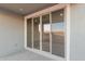 Modern sliding glass doors leading to a backyard patio at 21641 N Daniel Dr, Maricopa, AZ 85138
