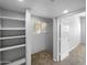 Finished basement featuring carpet, storage shelves, a window, and an entrance to another room at 4925 N 73Rd St # 4, Scottsdale, AZ 85251