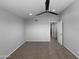 Spacious carpeted bedroom featuring a ceiling fan, neutral walls, and a walk-in closet at 4925 N 73Rd St # 4, Scottsdale, AZ 85251