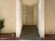 Close up view of the front door entryway to the home with security screen and block wall at 4925 N 73Rd St # 4, Scottsdale, AZ 85251