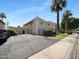 View of the building with desert landscaping, car parking, and palm trees on a sunny day at 4925 N 73Rd St # 4, Scottsdale, AZ 85251