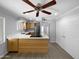 Eat-in kitchen with stainless steel appliances, quartz countertops, a breakfast bar, and modern lighting at 4925 N 73Rd St # 4, Scottsdale, AZ 85251