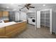 Open kitchen with stainless steel appliances, white counters, laundry area with washer and dryer behind the doors at 4925 N 73Rd St # 4, Scottsdale, AZ 85251