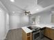 Bright kitchen featuring white countertops, stainless steel oven, wood cabinets and modern ceiling fan at 4925 N 73Rd St # 4, Scottsdale, AZ 85251