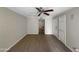 Spacious living room with wood flooring, neutral paint, and white trim throughout the space at 4925 N 73Rd St # 4, Scottsdale, AZ 85251