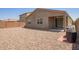 Backyard featuring stone ground cover, block wall, and patio at 37127 N Big Bend Rd, San Tan Valley, AZ 85140