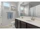 Bathroom featuring a double sink vanity, tile floors, and a large mirror at 37127 N Big Bend Rd, San Tan Valley, AZ 85140