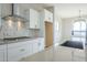 Modern kitchen features with white cabinets and large island at 20277 W Mulberry Dr, Buckeye, AZ 85396