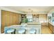 Spacious kitchen with a large center island, breakfast bar, and modern cabinetry at 4350 N Jokake Dr, Scottsdale, AZ 85251