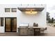 Inviting outdoor kitchen featuring a stainless steel BBQ, countertop with bar seating, and stylish decor at 4350 N Jokake Dr, Scottsdale, AZ 85251