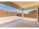 The backyard offers a covered patio and block wall for privacy at 20262 W Hollyhock St, Buckeye, AZ 85396