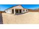 The backyard offers a covered patio and has lots of space at 20262 W Hollyhock St, Buckeye, AZ 85396