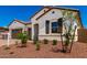 Charming single-story home with a tile roof, stucco exterior, and desert landscaping at 20262 W Hollyhock St, Buckeye, AZ 85396