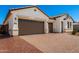 Charming single-story home featuring a two-car garage and well manicured brick driveway at 20262 W Hollyhock St, Buckeye, AZ 85396