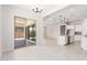 Spacious living room featuring tile flooring, sliding glass doors, and an open view to the kitchen at 20262 W Hollyhock St, Buckeye, AZ 85396