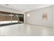 Bright, open living room features sliding glass doors, tile flooring, and plenty of natural light at 20262 W Hollyhock St, Buckeye, AZ 85396