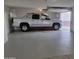A spacious three car garage offering ample room for parking and additional storage at 9710 W Campana Dr, Sun City, AZ 85351