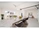 Bright kitchen boasts a large quartz island with bar seating and stainless steel appliances at 9710 W Campana Dr, Sun City, AZ 85351
