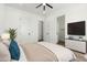 Bedroom showcasing plush bedding, and a mounted television, creating a relaxing retreat at 31730 N 169Th Ave, Surprise, AZ 85387