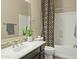 Clean bathroom with single vanity and shower/tub combo at 7054 E Ingram St, Mesa, AZ 85207