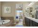 Elegant bathroom with double vanity, large mirror, and access to bedroom at 7054 E Ingram St, Mesa, AZ 85207