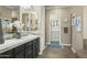 Spacious bathroom with double vanity, and access to walk-in closet at 7054 E Ingram St, Mesa, AZ 85207
