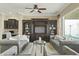 Spacious living room with two sofas and a large TV at 7054 E Ingram St, Mesa, AZ 85207