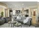 Open living room with gray sofas and views into the kitchen at 7054 E Ingram St, Mesa, AZ 85207