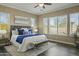 Large main bedroom with plush bed and plenty of natural light at 7054 E Ingram St, Mesa, AZ 85207