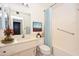 Clean bathroom featuring a vanity with drawers, a well-lit mirror, and a tub/shower combo at 10802 W Cameo Dr, Sun City, AZ 85351