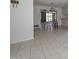 Open dining area with tile flooring and a view of the outdoor patio at 10802 W Cameo Dr, Sun City, AZ 85351