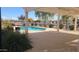 Relaxing community pool under covered patio at 2300 E Magma Rd # 126, San Tan Valley, AZ 85143