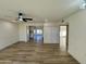 Bright living room with wood-look floors and ceiling fan at 512 Leisure World --, Mesa, AZ 85206