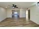 Bright living room with wood-look floors and ceiling fan at 512 Leisure World --, Mesa, AZ 85206