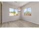 Dining room with light flooring and a modern globe chandelier at 16372 W Avenida Del Sol --, Surprise, AZ 85387