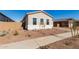 New construction home with landscaping and driveway at 16372 W Avenida Del Sol --, Surprise, AZ 85387