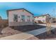 Single-story home with three windows and desert landscaping at 16355 W Avenida Del Sol --, Surprise, AZ 85387