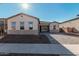 Two-car garage and inviting front yard with paver driveway at 16355 W Avenida Del Sol --, Surprise, AZ 85387