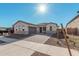 Two-car garage and inviting front yard with paver driveway at 16355 W Avenida Del Sol --, Surprise, AZ 85387