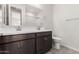 Double sink bathroom with a toilet and tiled floor at 40519 W Wade Dr, Maricopa, AZ 85138