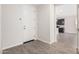 Bright entryway with tile flooring and view into kitchen at 40519 W Wade Dr, Maricopa, AZ 85138