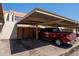 Carport featuring covered parking to protect vehicles from the elements in a residential community at 6337 N 49Th Ave, Glendale, AZ 85301