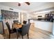 Open concept kitchen and dining area with a marble table set and black chairs at 6337 N 49Th Ave, Glendale, AZ 85301