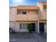 Two-story townhome with a private balcony and a desert-landscaped front yard at 6337 N 49Th Ave, Glendale, AZ 85301