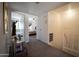 Hallway with carpeted floors, leading to bedrooms and the staircase at 6337 N 49Th Ave, Glendale, AZ 85301