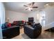 Bright living room with leather furniture, and wood flooring at 6337 N 49Th Ave, Glendale, AZ 85301