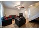 Spacious living room with leather furniture, and wood flooring at 6337 N 49Th Ave, Glendale, AZ 85301