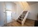 Bright and airy staircase leading to the upper level of the home, with a safety gate at the base at 6337 N 49Th Ave, Glendale, AZ 85301