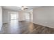 Living room with wood-look floors and ceiling fan at 11104 W Gaytime Ct, Sun City, AZ 85351